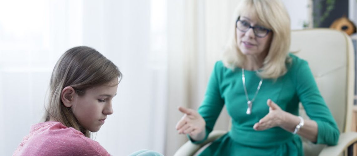 Experienced psychologist solving teenage girl's problem