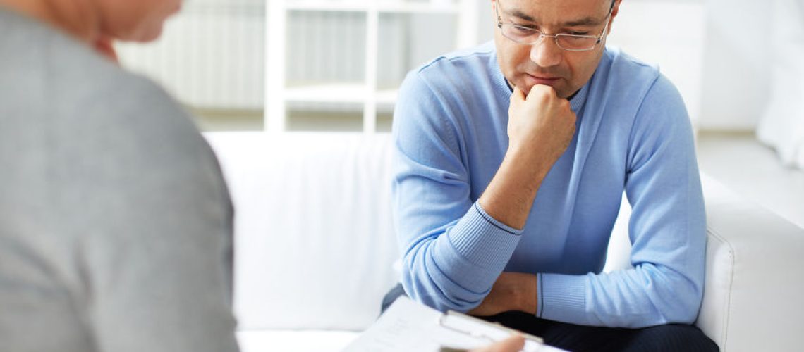 37750665 - man sharing problems with psychologist