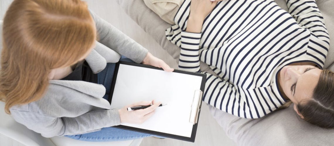 97184917 - high angle of therapist analyzing the behavior of a patient with emotional problem